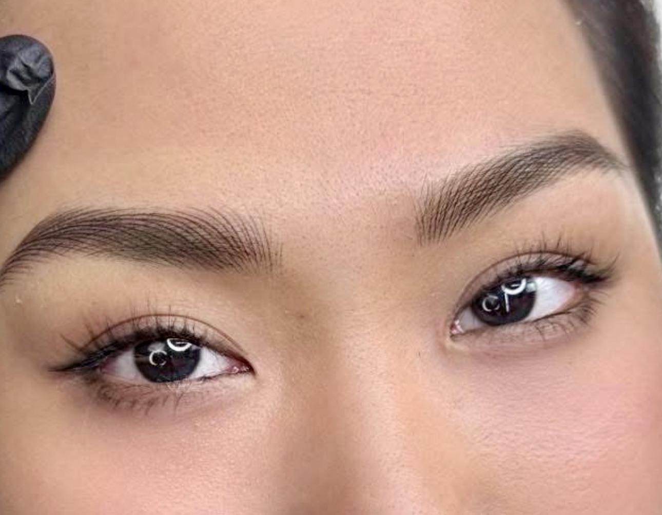 A close up of the eyes of a woman